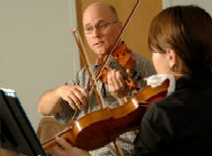 violin lesson teacher and student